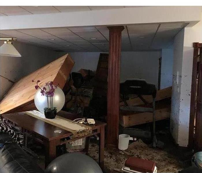 Furniture flipped in a room due to a flood