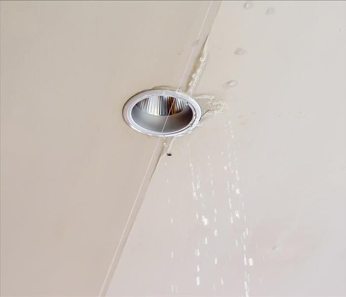 water coming out a light fixture