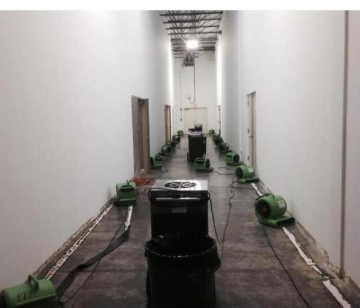 Air movers placed in a long hallway